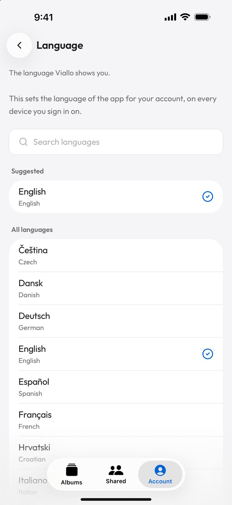 The Language screen on a phone in English: The language Viallo shows you, the line This sets the language of the app for your account, on every device you sign in on, a Search languages box, English under Suggested, and All languages listing Čeština Czech, Dansk Danish, Deutsch German, English, Español Spanish, Français French and Hrvatski Croatian