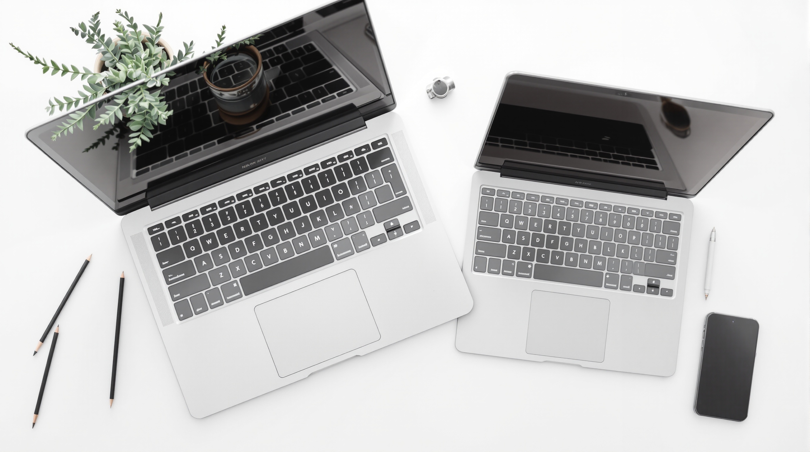 A laptop on a clean desk showing a photo gallery interface with a cup of coffee nearby, shot from above
